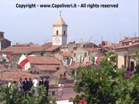 Il campanile di Capoliveri con le bandiere - Festa della Repubblica